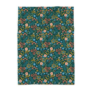 mage of a cotton tea towel featuring colorful stylized flowers in coral, green, blue and pink against a dark green background
