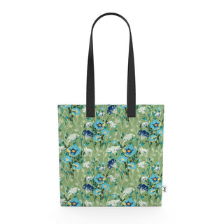 blue flowers on a green background tote