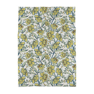 Image of tea towel with yellow flowrs and green leaves in a twining arrangement