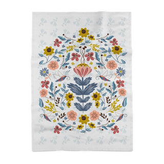 tea towel with illustration of flowers and moths in blues and peach and rust and gold. sold online at jean c studio