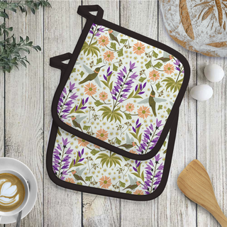 Floral patterned pot holder on a wooden surface with kitchen items.