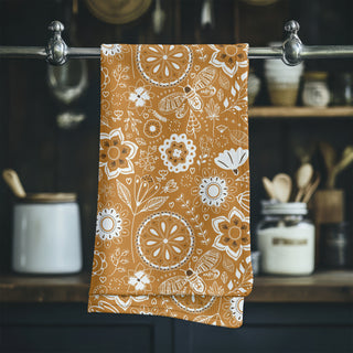 Hanging tea towel featuring illustration of hand drawn bees and flowers. Sold online at Jean C Studio