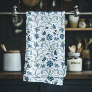 Image of tea towel with illustration of sparrows and flowers in blues and greens