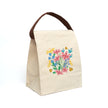 Beige lunch bag with strap with colorful floral design of flowers and ladybugs