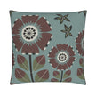 closeup image of a throw pillow. the pillow has a light teal background and 4 stylized brown and white flowers. Smaller dark green and light green flowers are in the background. 