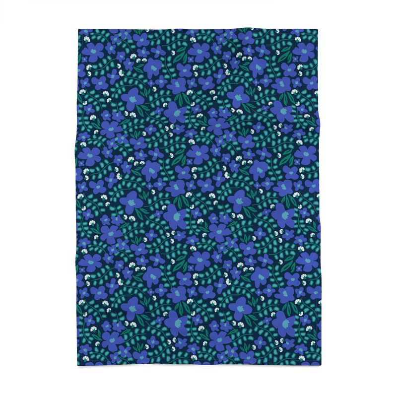 Image of a cotton tea towel featuring blue violets and green leaves