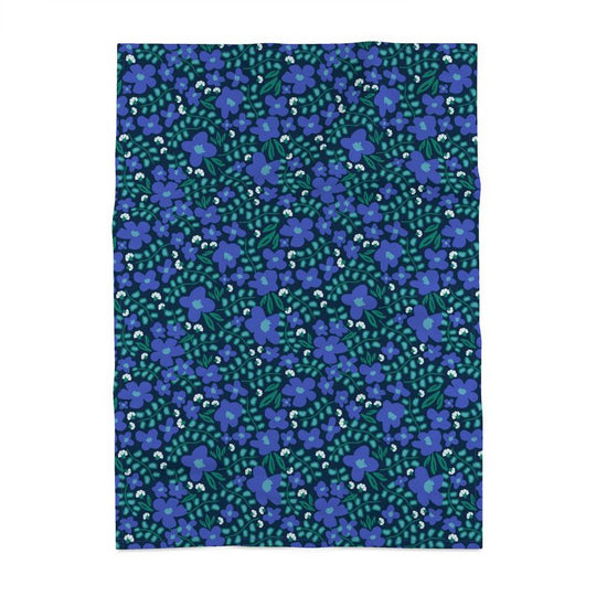Image of a cotton tea towel featuring blue violets and green leaves