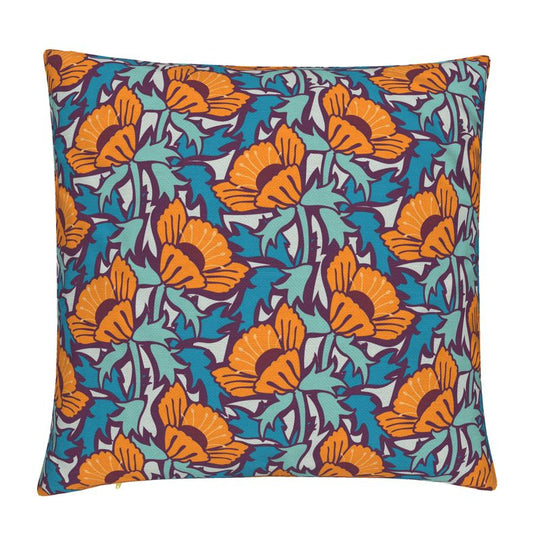 Image of pillow cover featuring bold large poppies in orange, surrounded by blue green leaves, on a dark background.