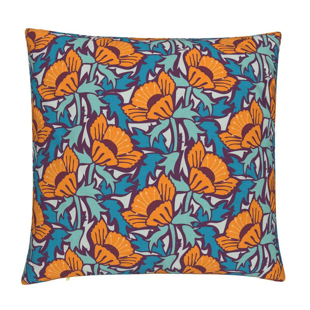 Image of pillow cover featuring bold large poppies in orange, surrounded by blue green leaves, on a dark background.