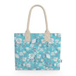 Image of tote bag with very pale blue flowers and grey blue leaves against a medium aqua blue background