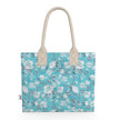 Image of tote bag with very pale blue flowers and grey blue leaves against a medium aqua blue background