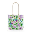 Image of tote bag with purple coneflowers, green and blue leaves against a pale gree background