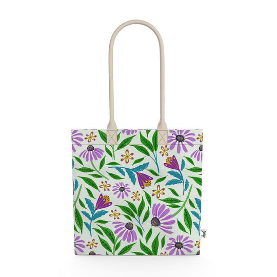Image of tote bag with purple coneflowers, green and blue leaves against a pale gree background