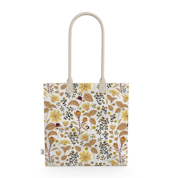 Image of tote bag with yellow flowers and tan and gold leaves against a white background