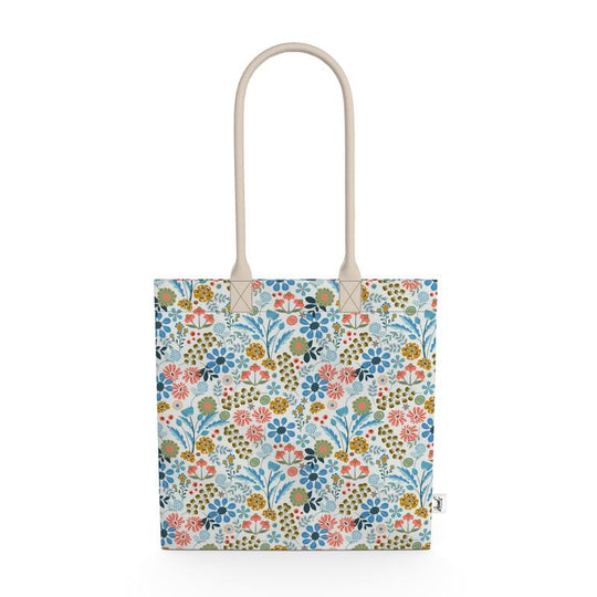 Image of tote bag with flowers in gold, green, blue and orange against a white background.