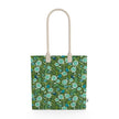 Image of tote bag with hand drawn flowers in pale blue. Also seen are blue birds and leaves.