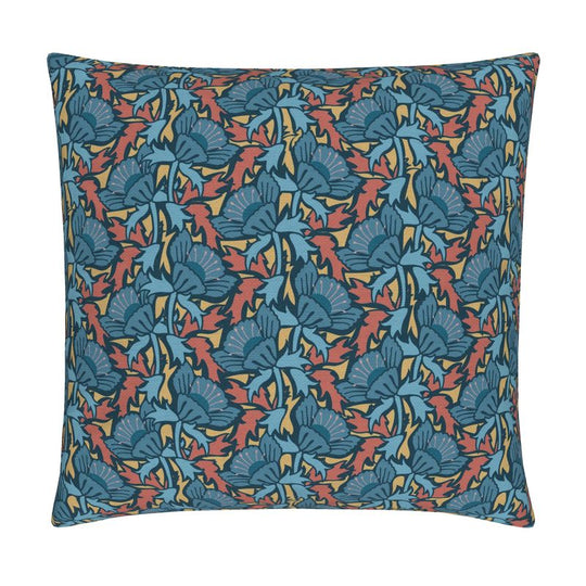 Image of pillow cover with bold blue blossoms and blue and rust colored leaves on a gold background.