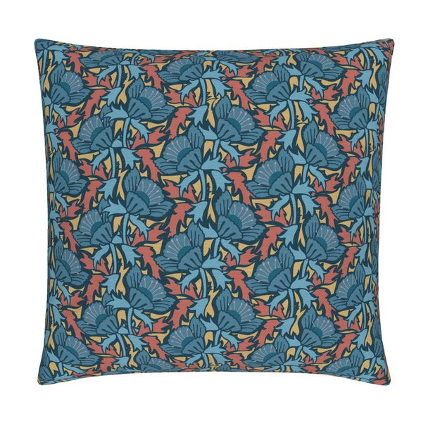 Image of pillow cover with bold blue blossoms and blue and rust colored leaves on a gold background.