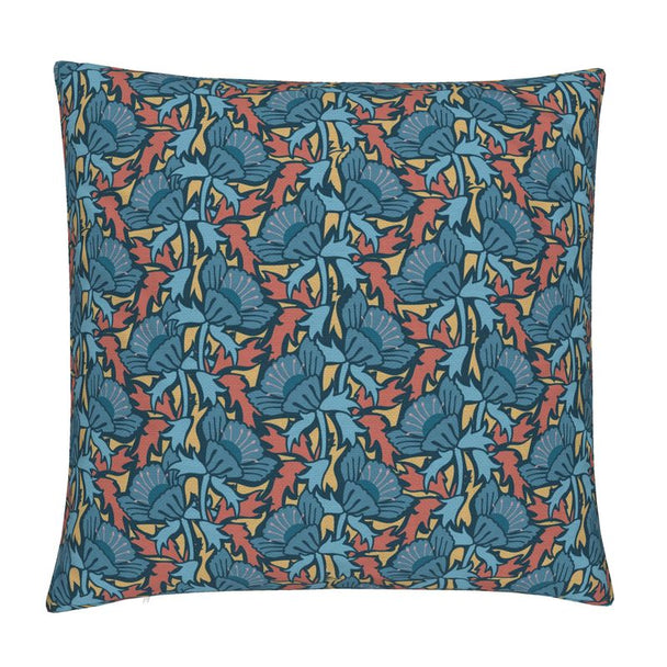 Image of pillow cover with bold blue blossoms and blue and rust colored leaves on a gold background.