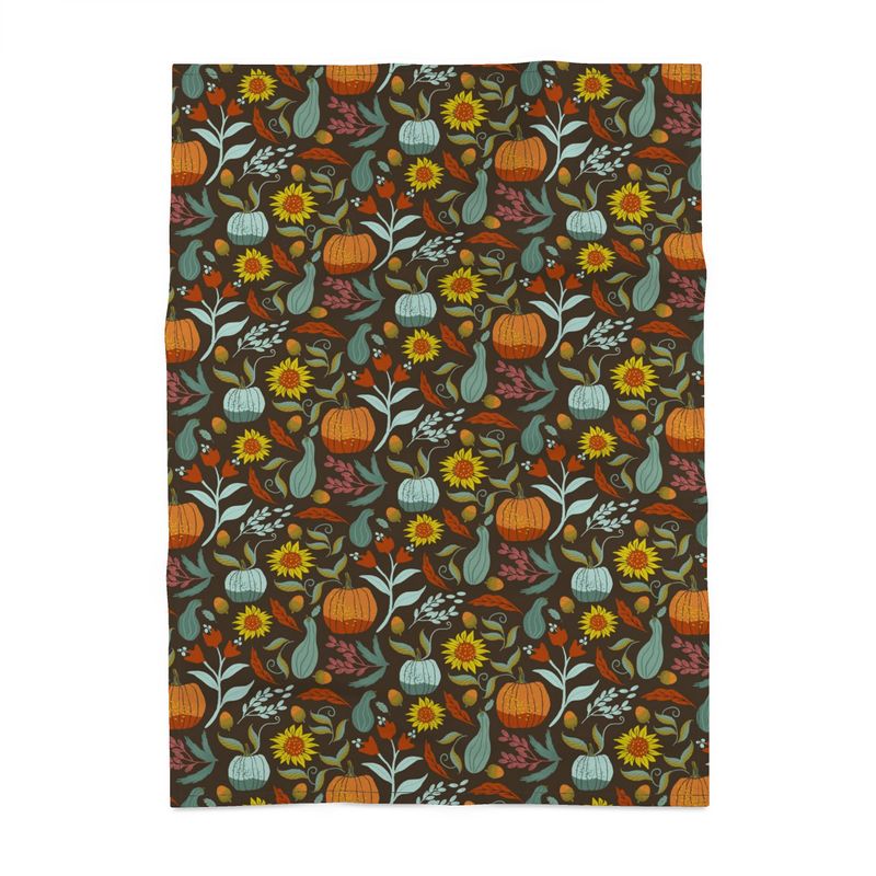 Image of tea towel with pumpkins, sunflowers, berries and leaves.