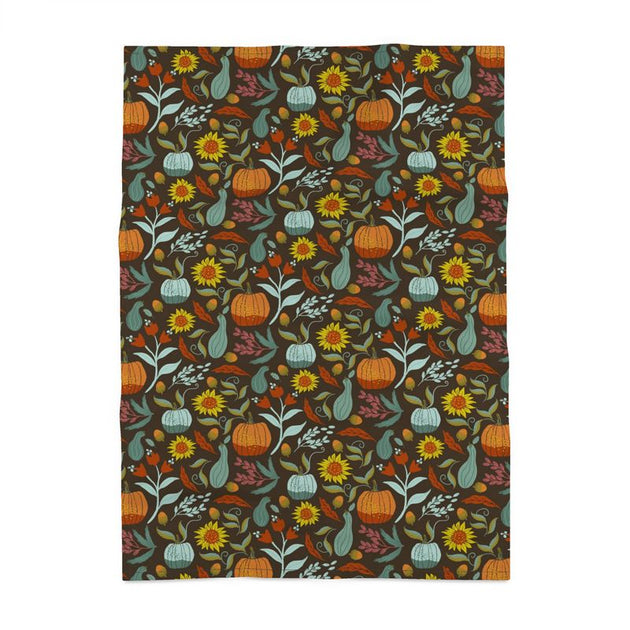 Image of tea towel with pumpkins, sunflowers, berries and leaves.