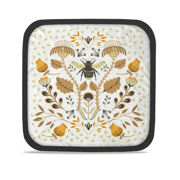 Image of two pot holders with illustration of bee and flowers in tan and orange.