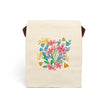 Beige lunch bag with colorful floral design of flowers and ladybugs