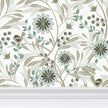 Image of wallpaper closeup featuring stylized pale green flowers, pale green and tan leaves and a cute tan bird against a white background